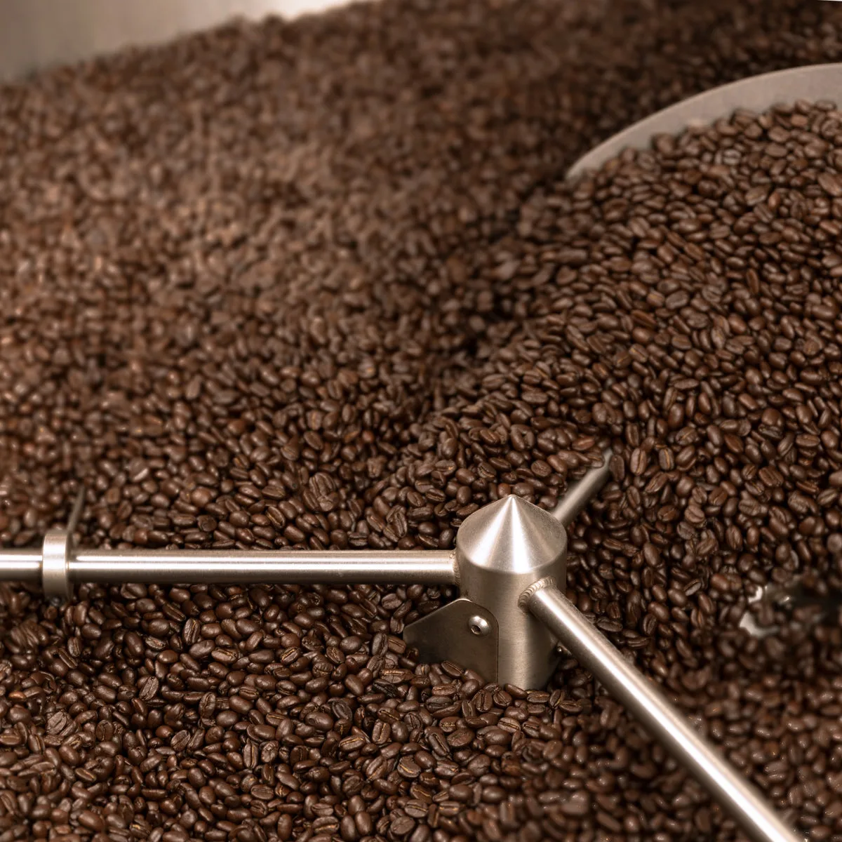 Freshly roasted beans turning in the Compass Coffee roaster